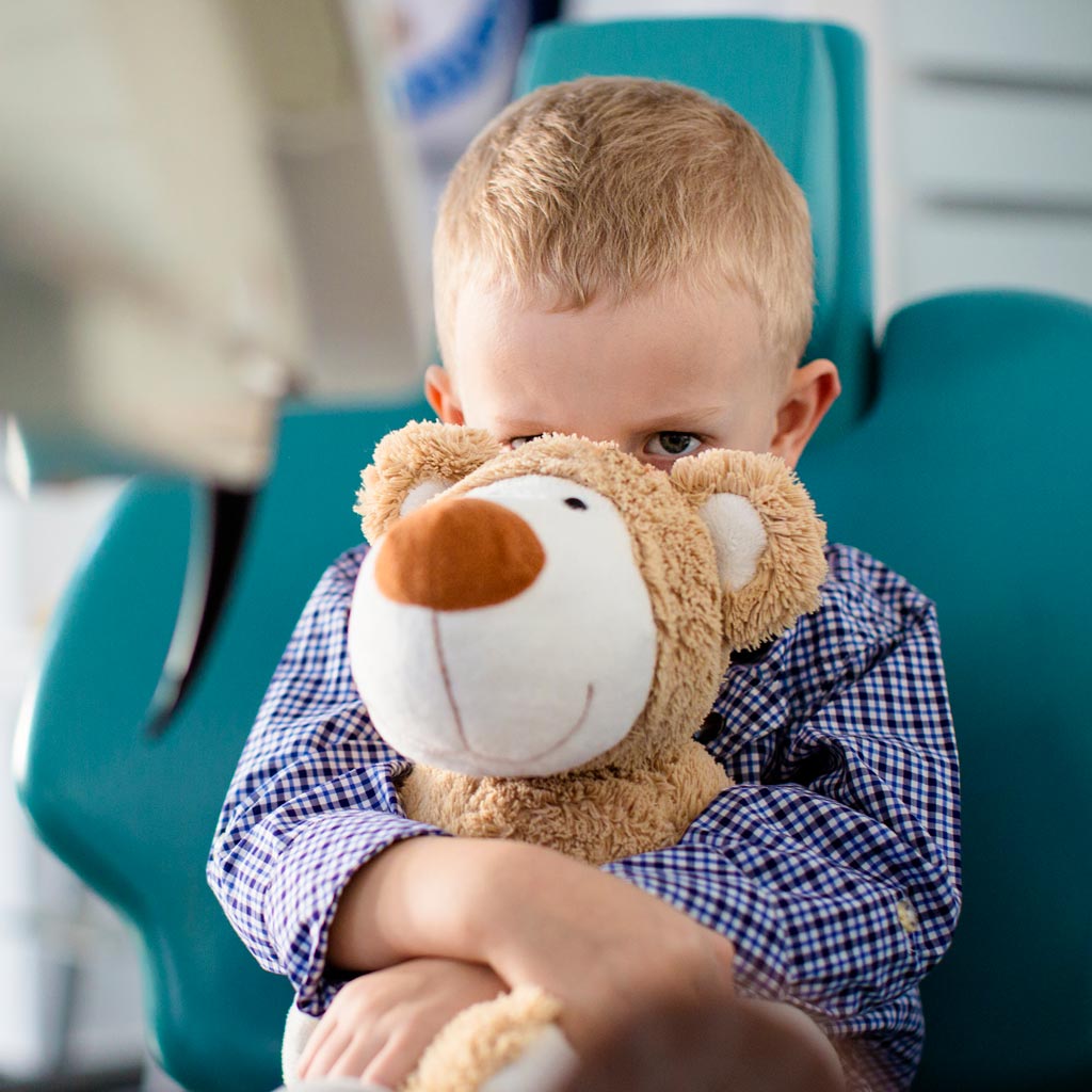 Boy with anxiety in dental chair