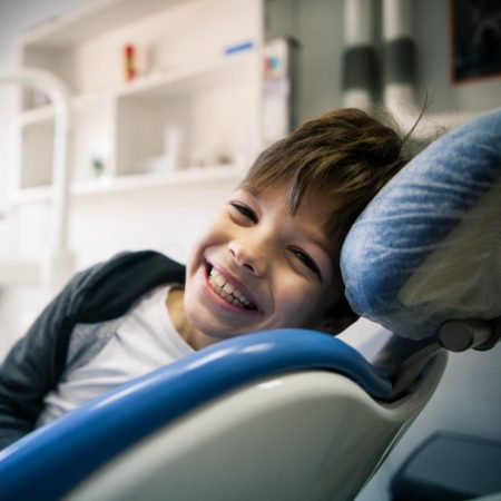 Smiling boy in dental chair